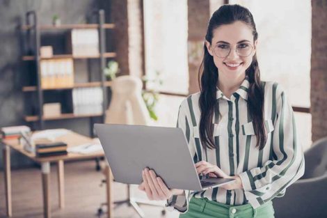 smiling woman with computer business development manager utilities